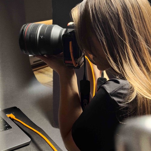 Angled connector protects camera and computer connection